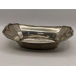 An early/mid 20th century sterling silver octagonal formed dish having sausage and pea decoration