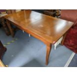 A reproduction French style rectangular topped extending dining table, with one extra leaf, 77cm h x