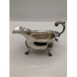 A silver sauce boat with acanthus handle (missing a foot) 229g