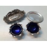 Two Indian silver coloured metal salts, silver bon bon dish and a silver pin dish, 98g Location: