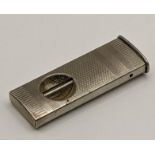 A white metal cigar cutter having engine turned detail, total weight 14.5g Location: