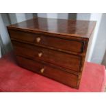 A 19th century collectors chest of three graduating drawers having boxwood inlaid and turned
