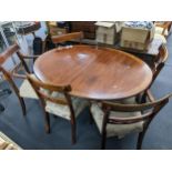 A reproduction Brights of Nettlebed mahogany oval extending dining table with one extra leaf 74cm