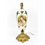 A 19th century bohemian overlay glass lamp, with central painted portrait of a woman with flowers