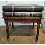 A Maitland-Smith faux book side table, with three trompe l'oeil drawers, 62 cm high x 55 cm wide x