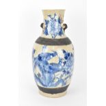 A 19th century Chinese blue and white baluster vase, with crackled glaze and bronze effect