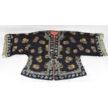 A Chinese Qing dynasty embroidered silk jacket, in navy with gilt roundels and floral details to the