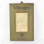 An early 20th century brass Schweppes advertising menu frame, with glazed aperture containing an old