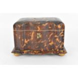 A 19th century tortoiseshell and ivory tea caddy, Regency period, with twin division interior with