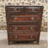 A Chinese black lacquered small chest of drawers, late 19th/early 20th century, designed of two