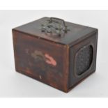A small Chinese early 20th century travel box, with pierced brass double swing handles to the top,