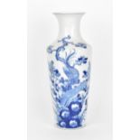 A Chinese late Qing dynasty blue and white porcelain vase, 19th century, of tapered form with