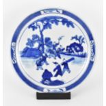 A Chinese Qing dynasty blue and white charger, in the Kangxi style but 19th century, with central