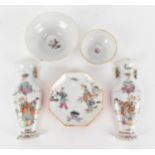 A pair of Chinese Famille Rose porcelain wall pockets, probably 18th century, in the shape of