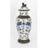 A 19th century Chinese blue and white lidded baluster vase, with crackled glaze and bronze effect