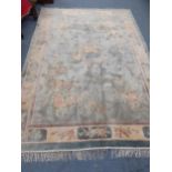 A Chinese hand knotted silk carpet in cream, blue and green 183cm x 274cm Location: A3M