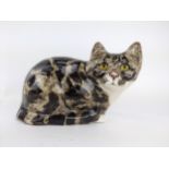 A large Winstanely model of a seated cat with tabby markings, 17cm high, 27cm long Location: