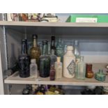 A mixed group of vintage glass and other advertising bottles to include 'Bovril Nectar of the Golden