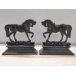 A pair of Victorian cast iron doorstops fashioned as horses on stepped bases, 28.5cm h x 28.5cm w