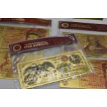 A group of Gold banknotes in plastic wallets to include, 24k stamped one Dollar, and 100 Dollar,