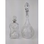 A late 20th century glass glug glug spirit decanter and a wine decanter with line cut decoration and