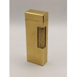 A Dunhill gold plated lighter having engine turned decoration Location: