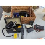 A group of cameras and accessories to include a Bell & Howell Zoom Reflex, Kodak Vest Pocket