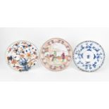 A small collection of Chinese 18th century plates, comprising a blue and white Kangxi plate with