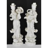 Two Chinese Blanc-de-Chine figures of Guanyin, Dehua, early 20th century, modelled standing raised