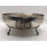 A Cypriot white metal bowl embossed with medallions and on ball feet, stamped 800, 473.8g Location: