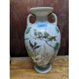 A late 19th century French opaline and enamelled twin handled vase decorated with birds amongst