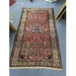 A North West Persian rug with central medallion, geometric motifs 195cm x 110cm Location: