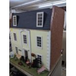 A large Georgian style brick effect doll's house with attic rooms, fully furnished Location: