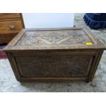 A late Victorian oak carved chest of small proportions, leaf carved top and sides with stylized