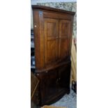 A George III oak corner cabinet, moulded cornice over twin fielded doors and shaped internal