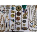 A quantity of vintage paste and enamelled brooches and mixed costume jewellery. Location:R2.3