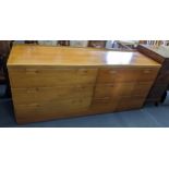 A vintage teak sideboard/chest of six short drawers on a plinth base 67cm h x 153cm w Location: