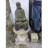 A group of weathered garden concrete ornaments to include a red painted Buddha figure on stand, a