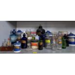 A collection of Victorian ceramics and glass chemist and druggist jars, most with chemical names