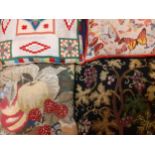 A quantity of mid to late 20th Century tapestry and embroidered cushions in various colours and