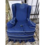 A Victorian upholstered wingback chair, blue checked pattern with loose seat cushions and arm