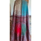 A large 20th Century Indian throw in reds, greens, turquoise blue and cream with Eastern machine