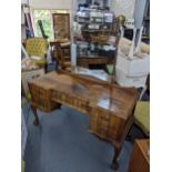 A South African hardwood dressing table having five drawers and on ball and claw feet, 157.5cm h x