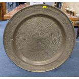 An early/mid 20th brass embossed large brass charger Location: