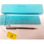 Tiffany & Co-A stainless steel pencil with gilt metal T-shaped clip and mounts with branded