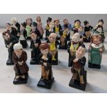 A collection of twenty four Royal Doulton porcelain Dickens figures to include Fagin, Scrooge and