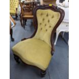 A Victorian mahogany nursing chair having button back upholstery, serpentine front and front bulbous