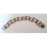 A Danish Sterling silver bracelet having 6 tablets with central Viking ship motif, makers mark