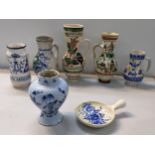 A selection of earthenware ceramics to include a 18th century Dutch delft vase, Romanian jugs and