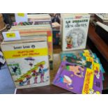 A collection of Herge Asterix, Lucky Luke, and other Herge Tintin titles to include L'Odyssee D'